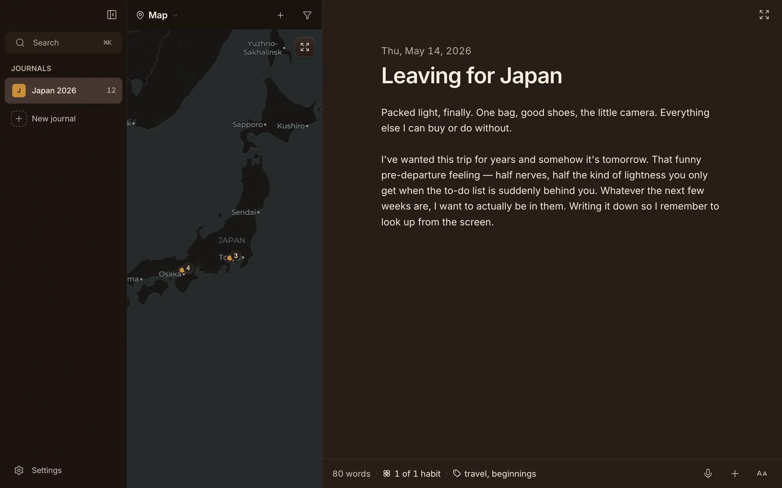 Cozy's map view, entries pinned across Japan. Dark theme.