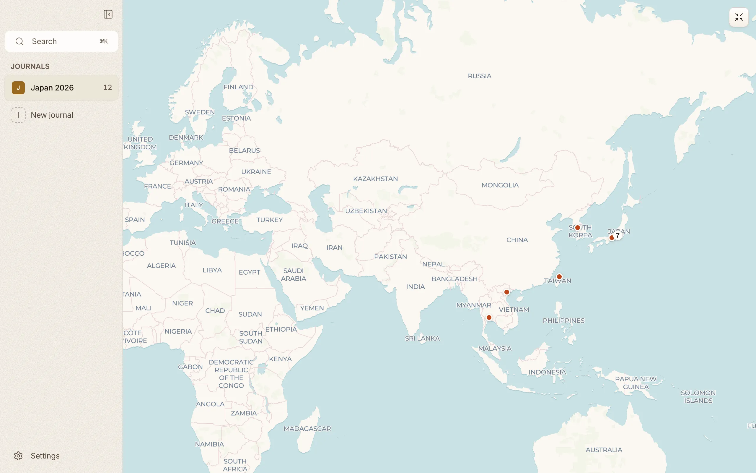 The map filling the whole window, with entry pins spread across the world